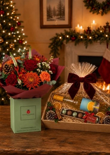 Orange-toned flowers, amber wine and chocolate create a cohesive Christmas present &pound;106